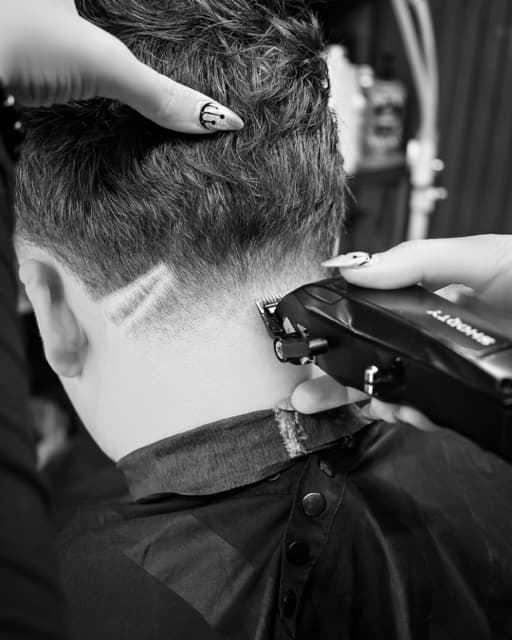 Close up of a precision skin fade with a shaved design at TJ Barber Newcastle