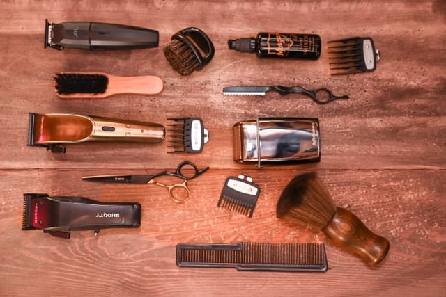 Barber tools laid out on a wooden table at TJ Barber Newcastle