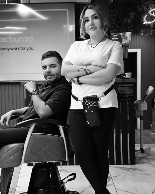 Tony and Jess, the barbers at TJ Barber Newcastle, in the shop on the Coast Road